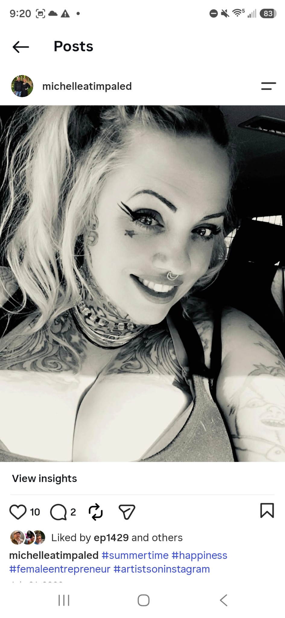 Michelle Frederick smiling in a black and white portrait
